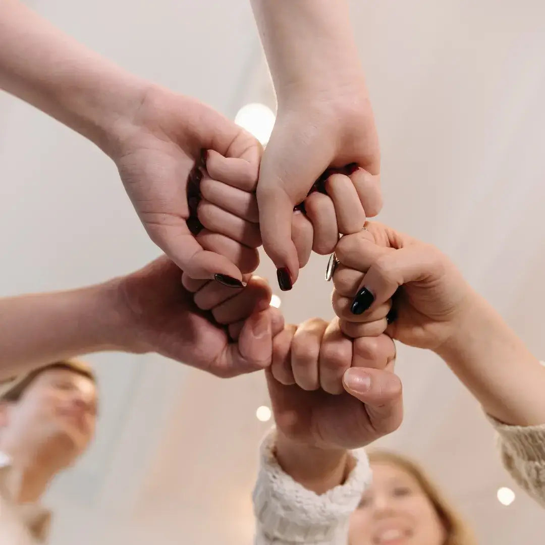 Hands forming a circle to symbolize wellness through community and shared health tracking with JupiterCore