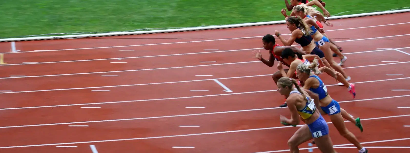 Students and athletes racing on a track, showcasing the benefits of JupiterCore smart ring for performance and wellbeing.